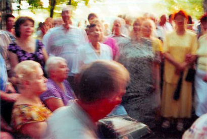 Old women and men dancing in Izmailovsky Park in Moscow