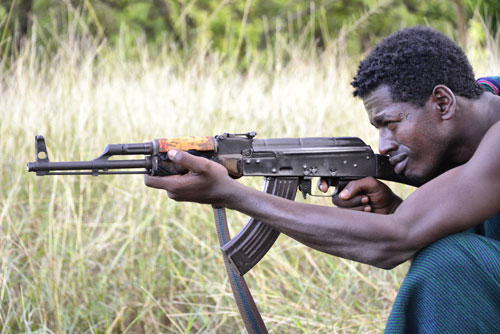 Suri with Kalashnikov AK-47 in Ethiopia photo by flickr.com/photos/rod_waddington