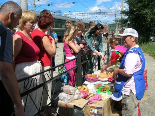 People buying food at a Trans-Siberian stop